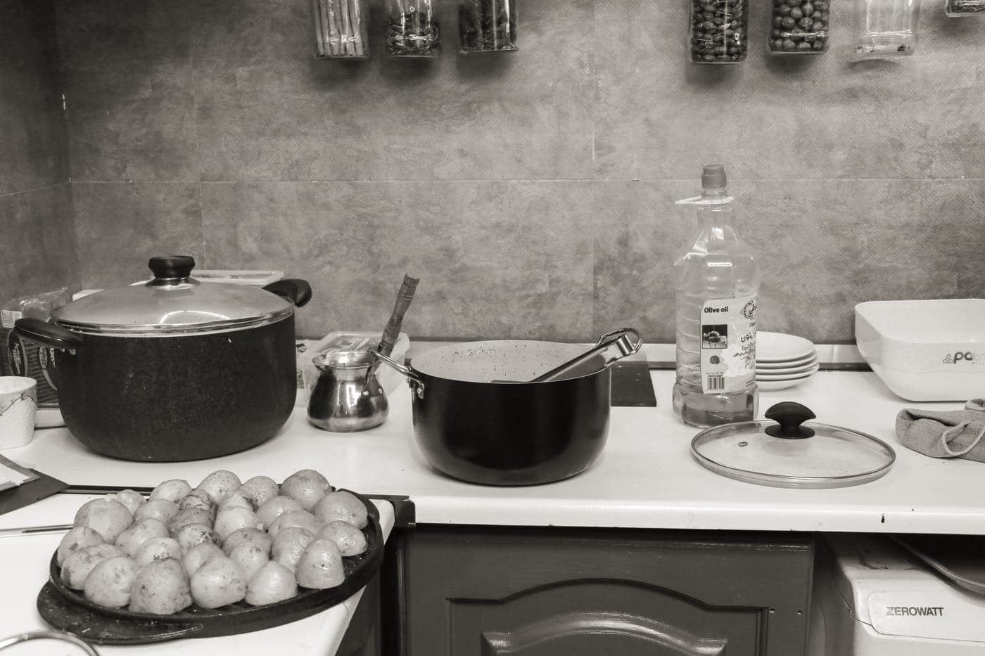 Essential pots and pans laid out on a table