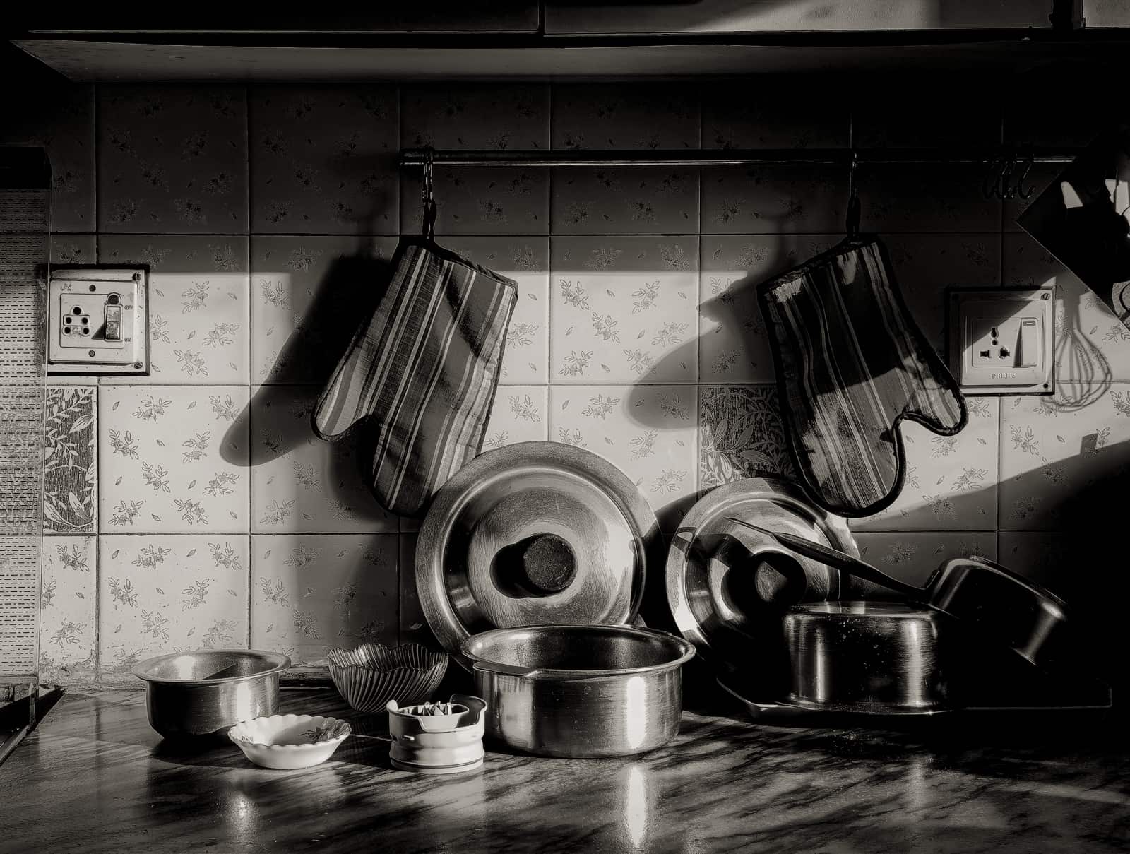 A matched set of pots and pans arranged together on a work surface